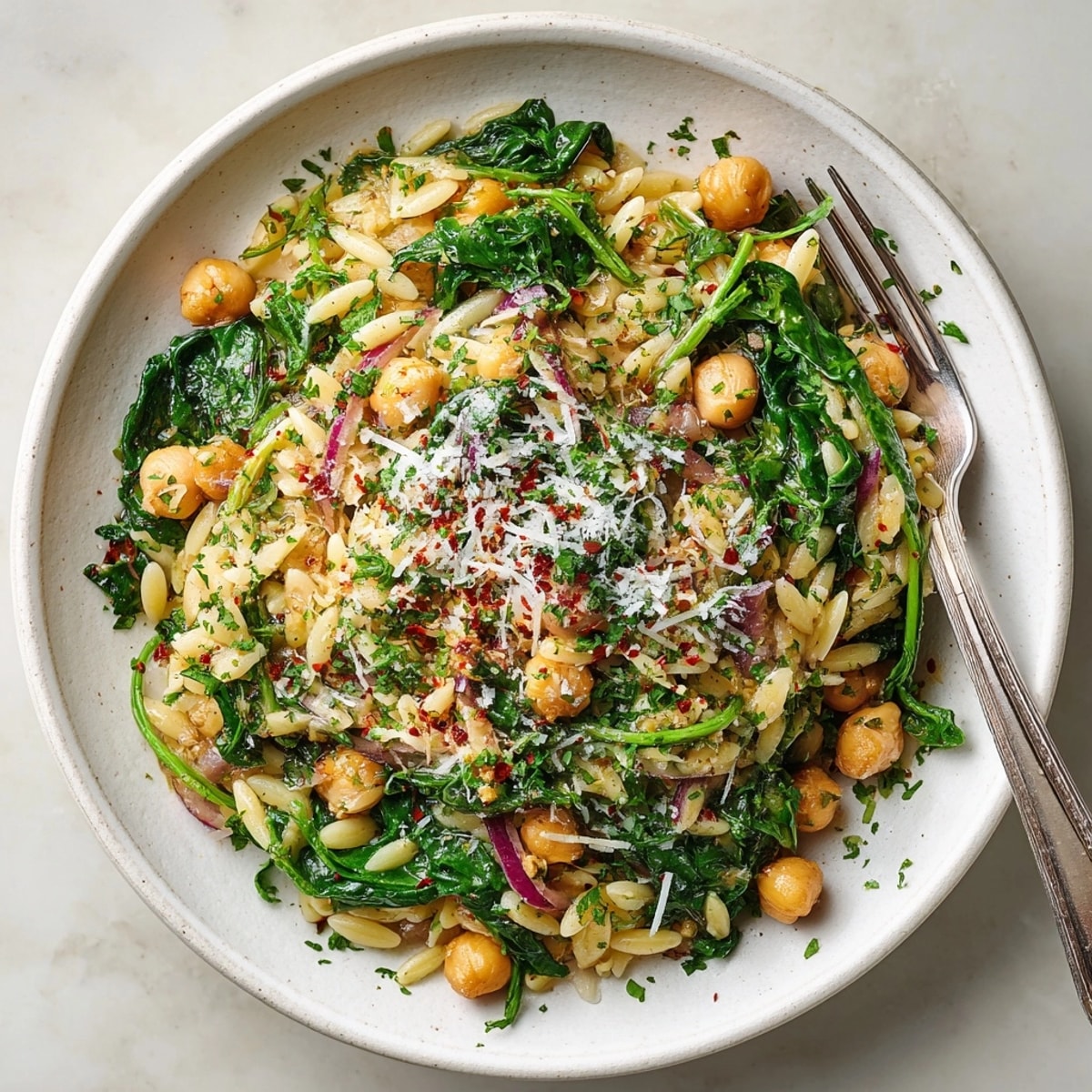 A satisfying bowl of 15-Minute Lemon-Garlic Chickpea Risoni: zesty, lemony, and ready in minutes.