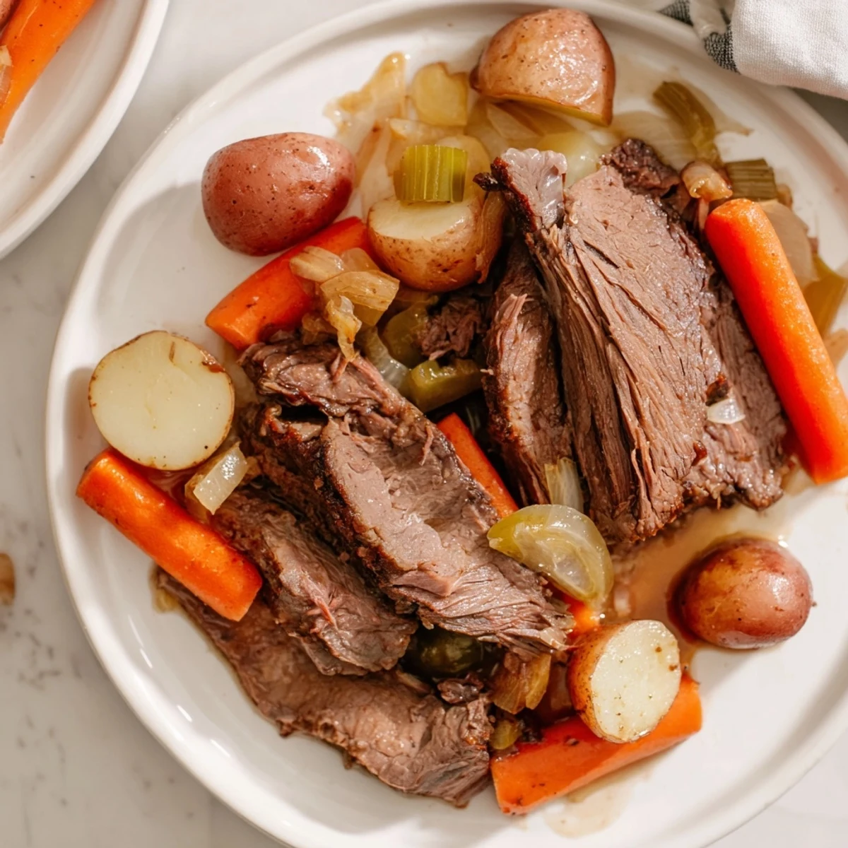 A close-up shot of the mouthwatering Pickle Brine Pot Roast with a delightful blend of pickles and spices.