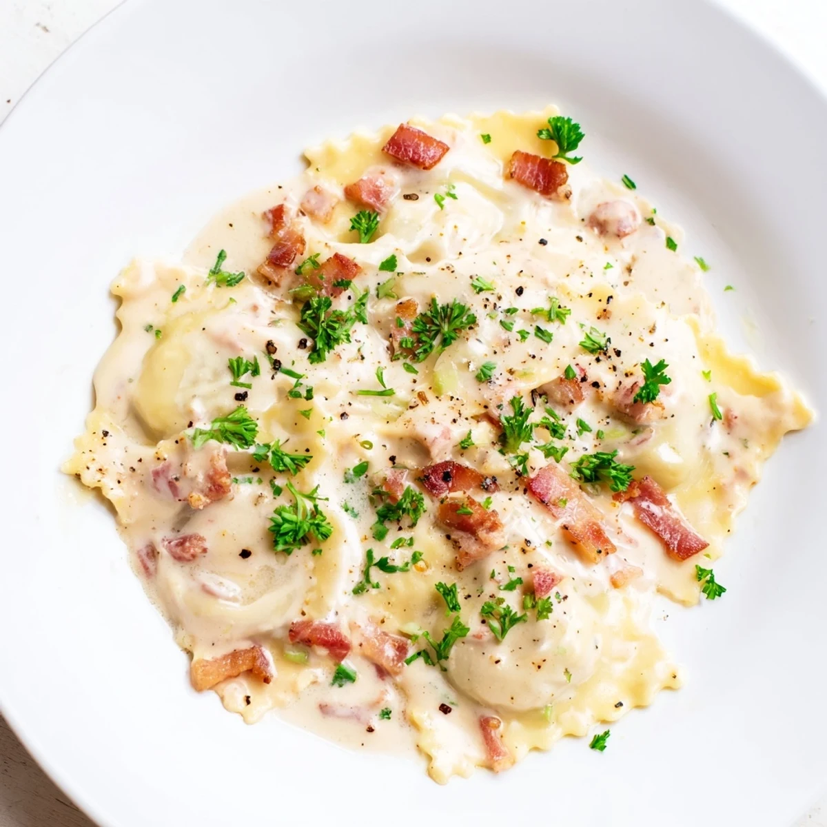 Creamy Olive Garden Ravioli Carbonara with crispy pancetta, perfect for a comforting Italian dinner.