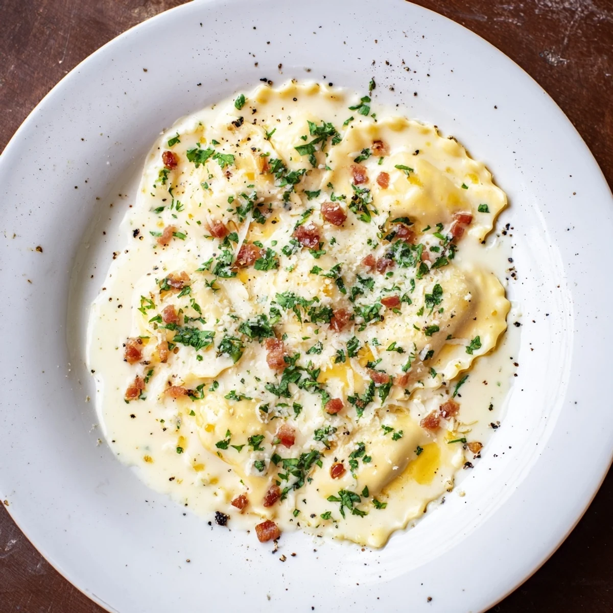 Delicious Olive Garden Ravioli Carbonara, a plate of cheese ravioli coated in savory, rich carbonara sauce.