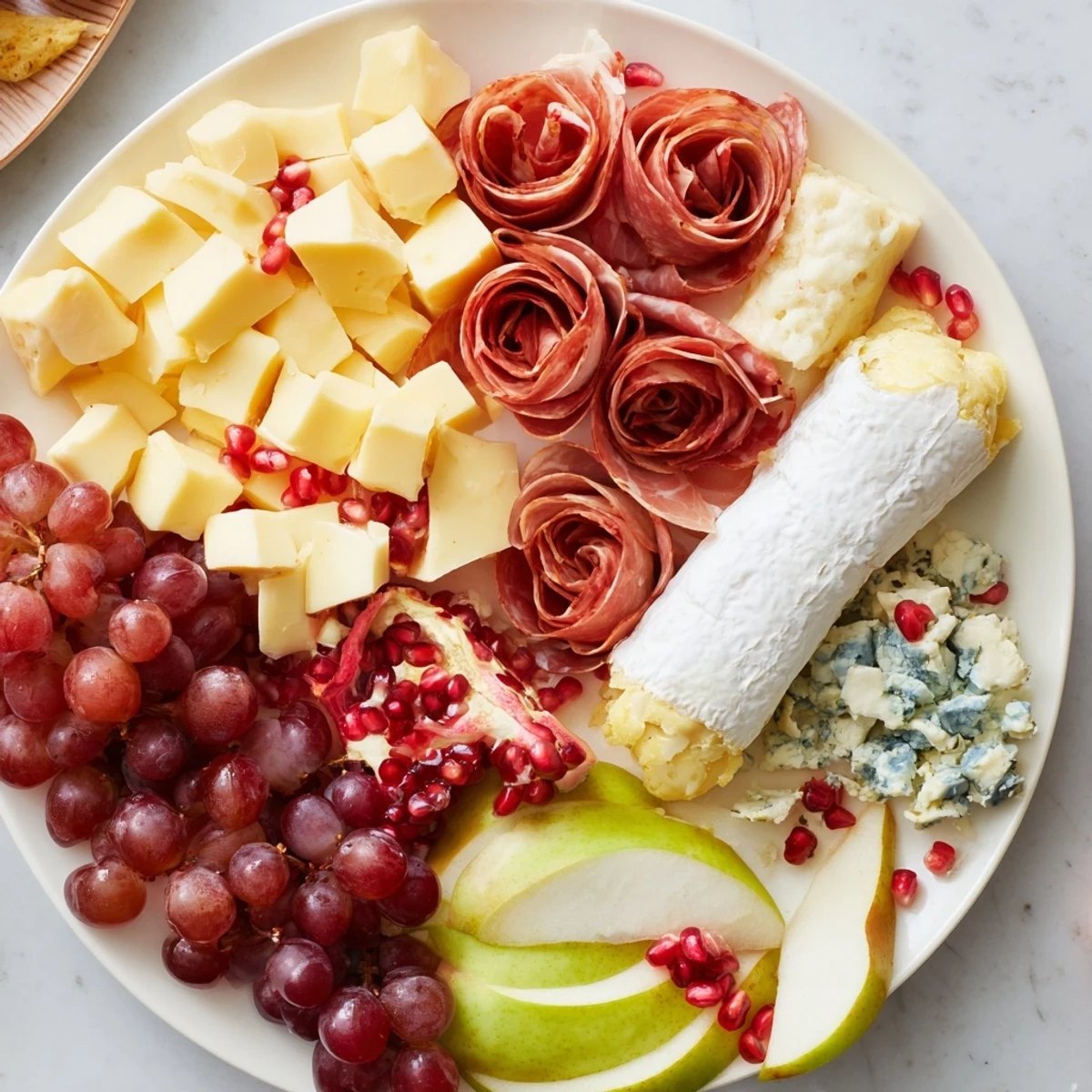 A beautiful Winter Wonderland Grazing Tray, overflowing with cheeses, fruits, and meats for sharing.