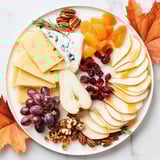 Vibrant Autumn Leaf Cheese Platter, boasting a stunning assortment of cheeses, perfect for a party appetizer.