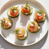 Celebrate with delicious champagne pairings: creamy brie, nutty walnuts, and juicy cherry tomatoes.