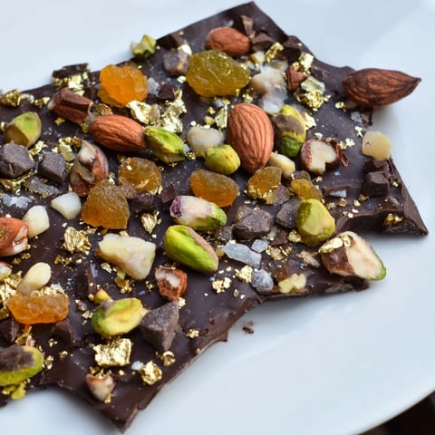Beautifully layered Simplified Dubai Chocolate Bark, ready to break and enjoy, studded with nuts and fruits.