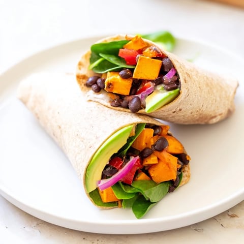 Savory Roasted Sweet Potato & Black Bean Holiday Wrap, perfectly wrapped and ready for a bite.