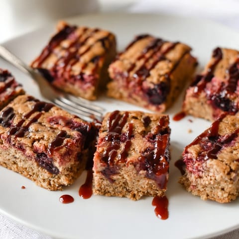 Deliciously buttery Cherry Cola Blondie Cookie Bars, studded with maraschino cherries and cola.  