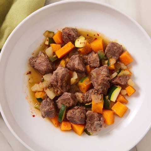 Sweet lamb platter for baby: Tender lamb and soft vegetables served in a baby bowl.
