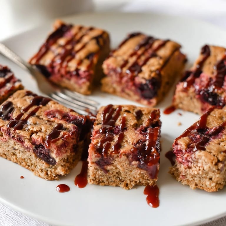 Deliciously buttery Cherry Cola Blondie Cookie Bars, studded with maraschino cherries and cola.  