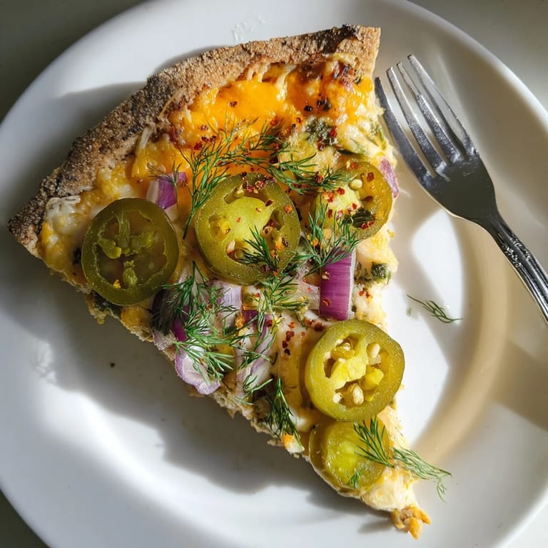 Sizzling Cheesy Jalapeño Pickle Pizza Pie with tangy pickles and vibrant colors.  