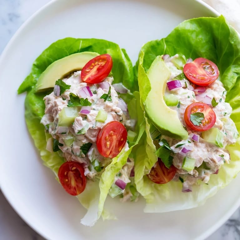 Bright photo of tuna salad lettuce wraps, showing a healthy lunch with fresh ingredients.