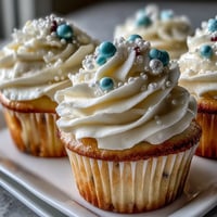 Cancer Birthday Cupcakes: Soft vanilla treats with shimmering pearl fondant, perfect for celebrations.